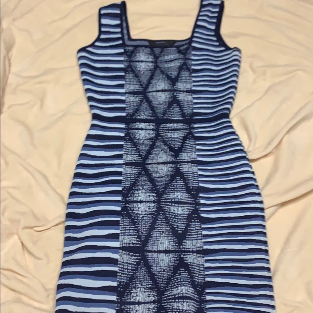 Turn heads in this blue multi patterned dress!